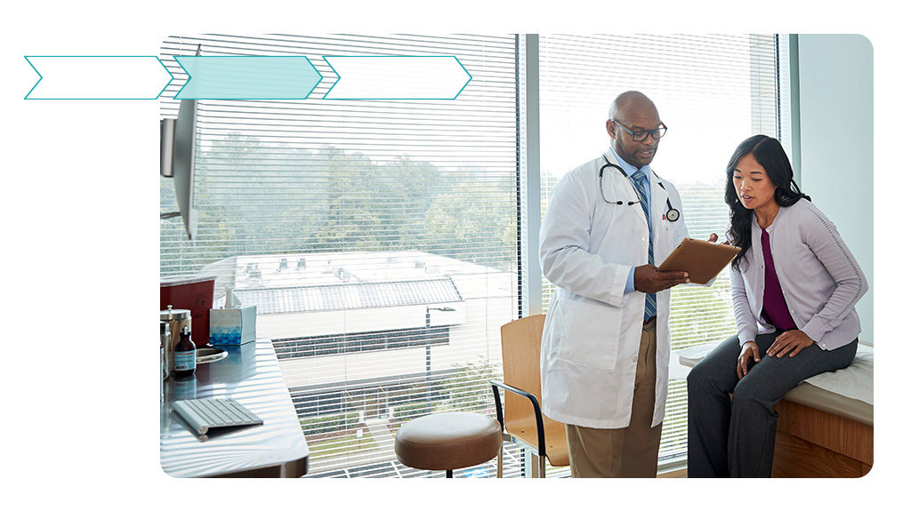 Stylized image of a doctor reviewing information with a patient