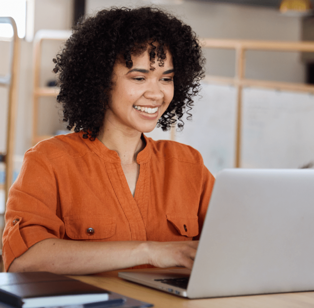 Stock image of a woman working at a laptop