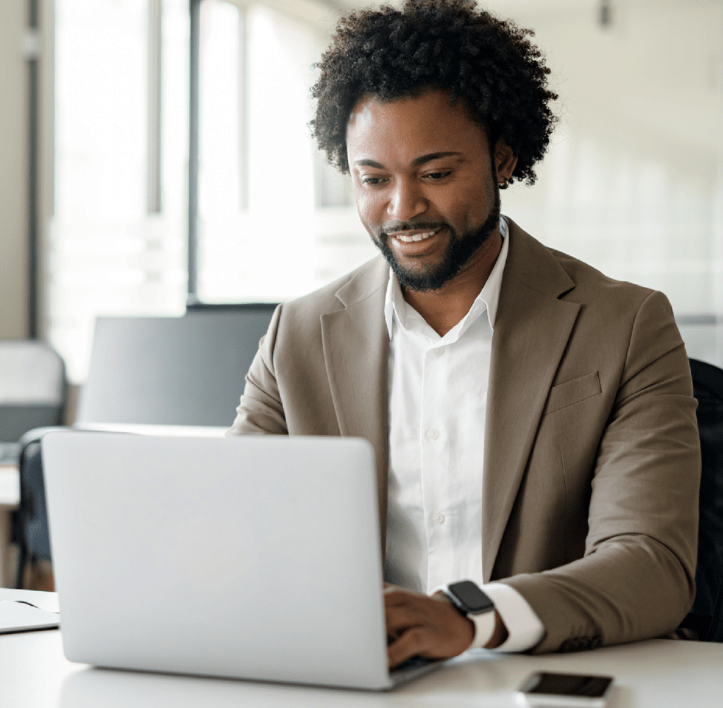 Stock image of a man working at a laptop